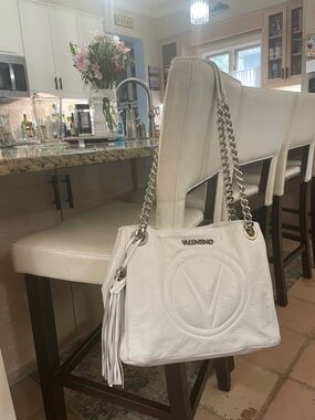 Valentino White Leather Shoulder Bag with silver Chain Straps and tassle.